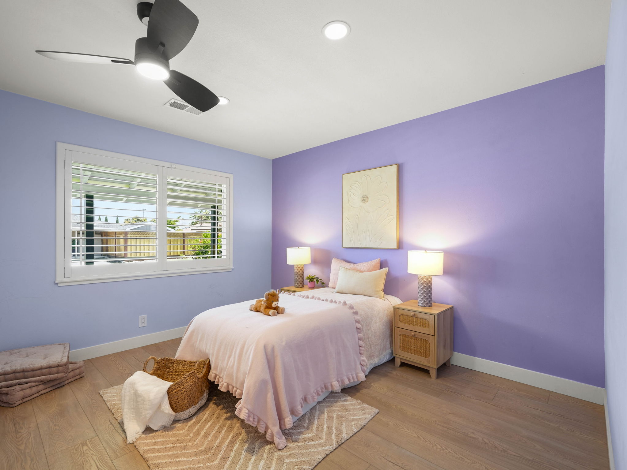 Kids bedroom with lavender accent wall