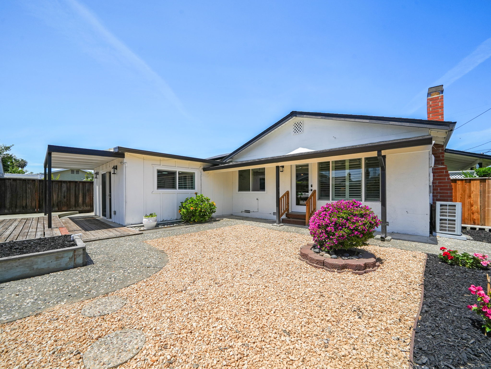 Rear of the home with covered patio