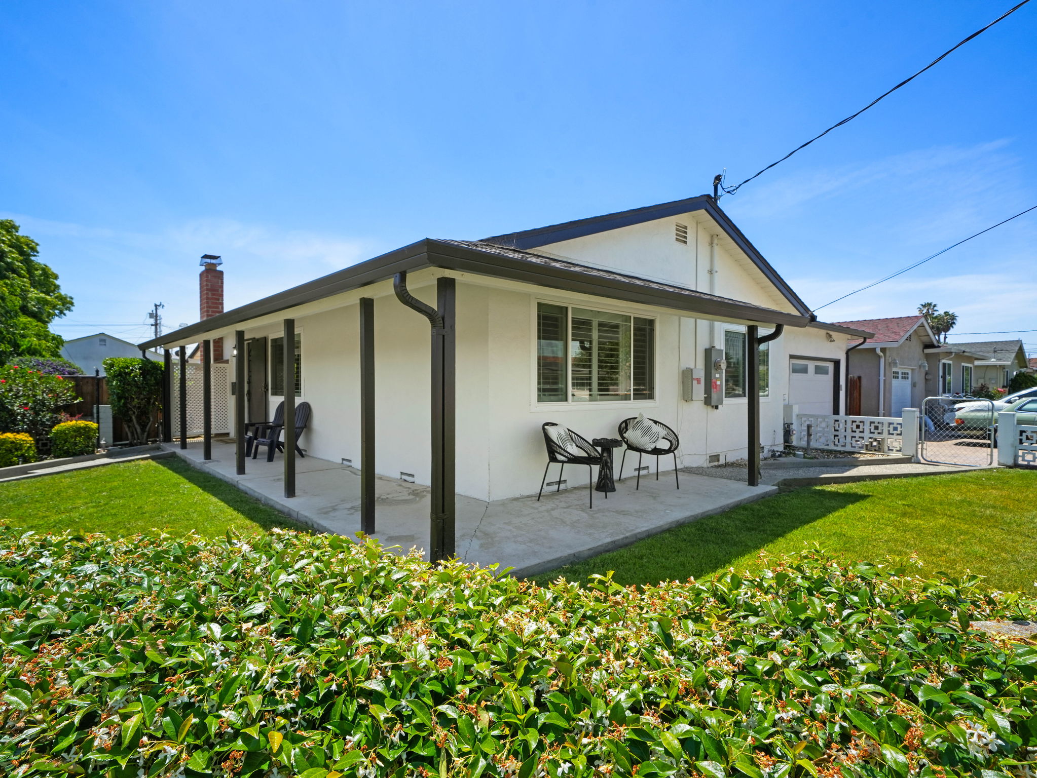 Back of the home with covered patio