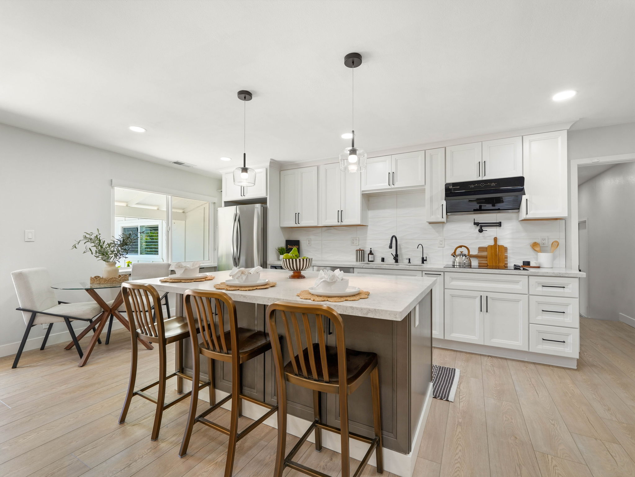 Updated kitchen with island and pendant lights