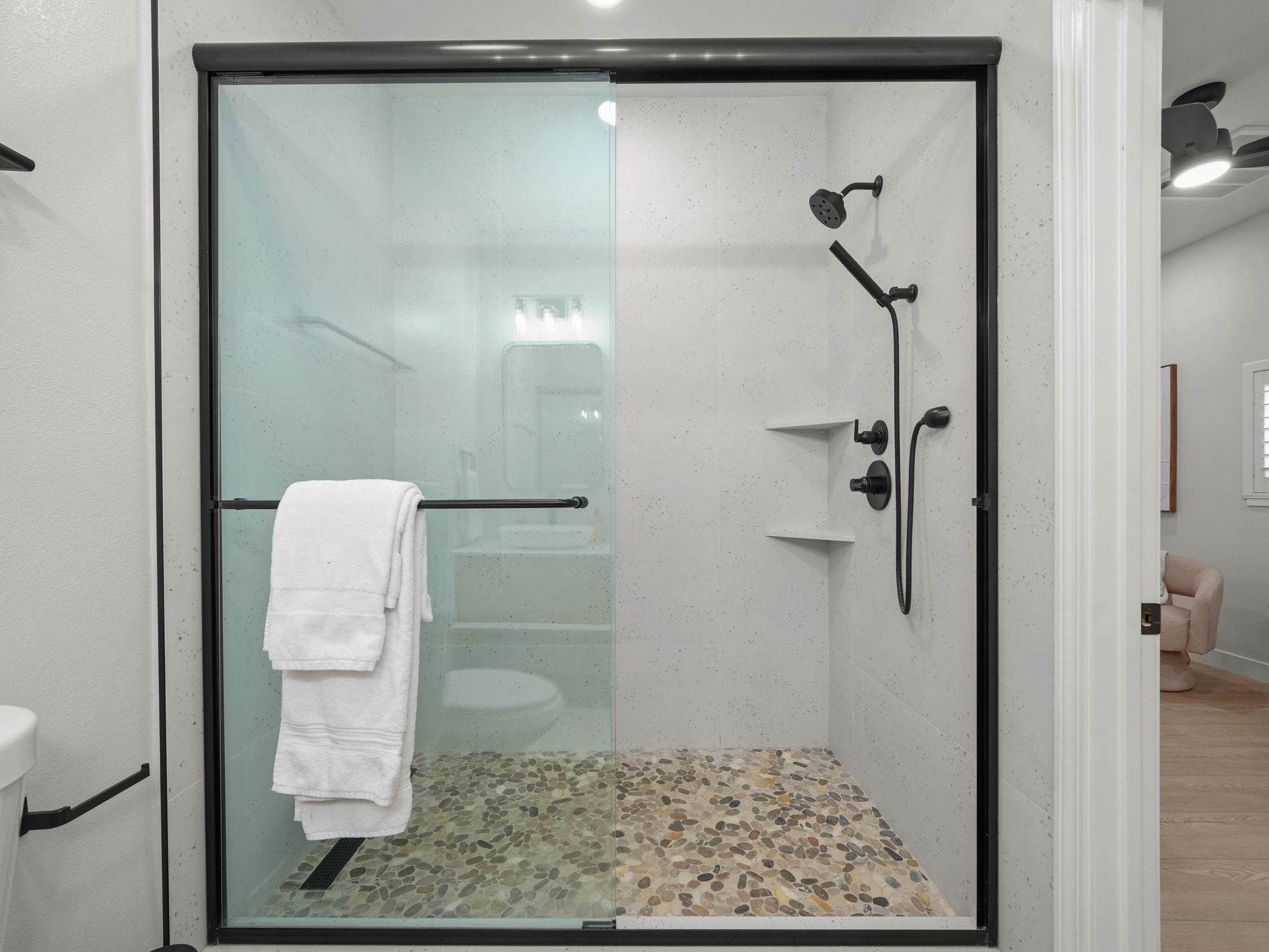 Walk-in pebble-floor shower in the master bath